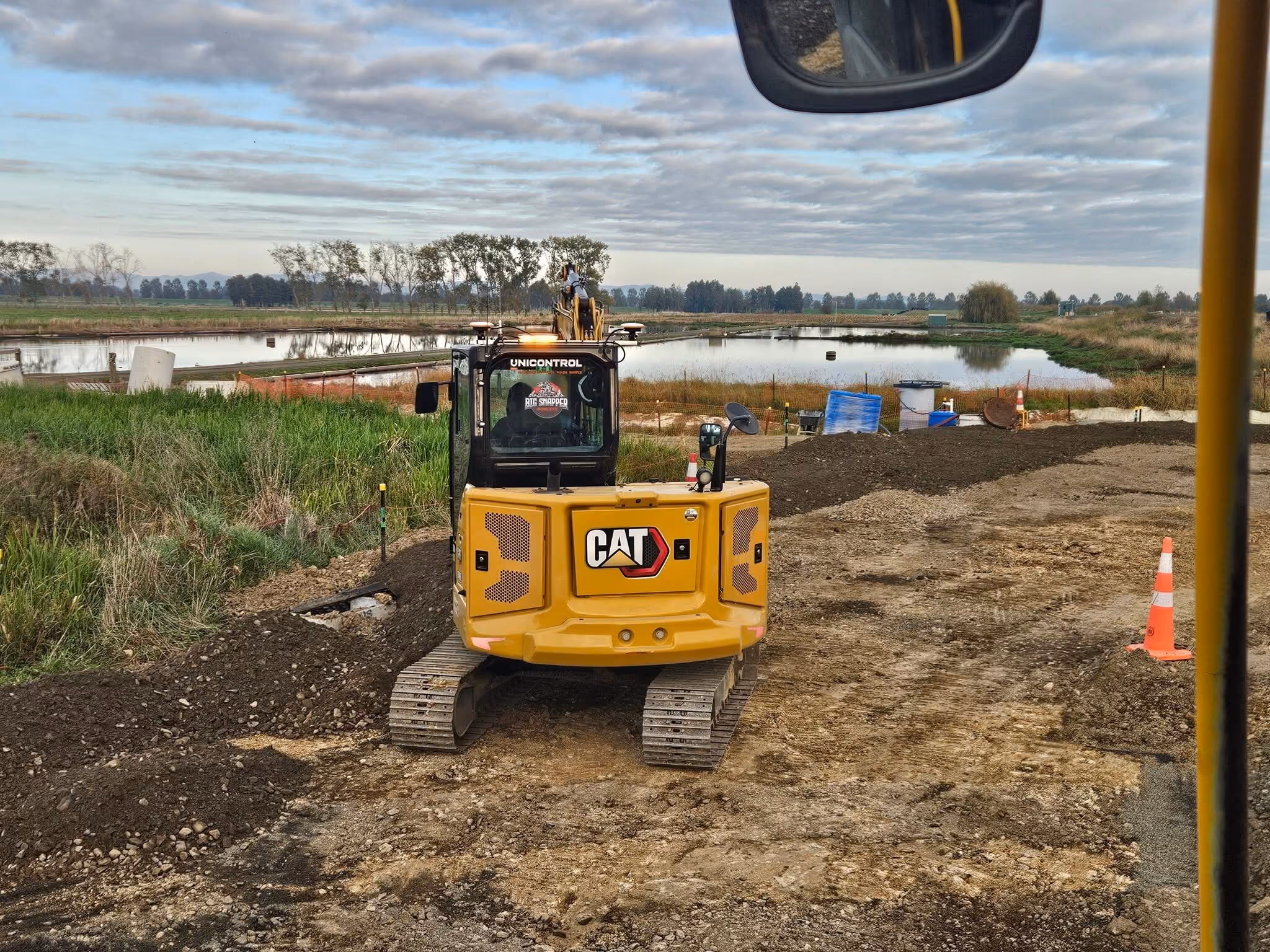 Cat excavator on an earthworks site