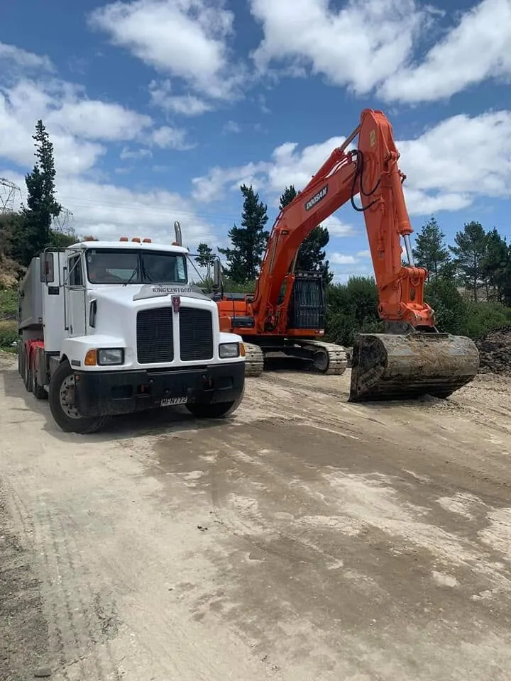 Truck and excavator loading on a Bay of Plenty site